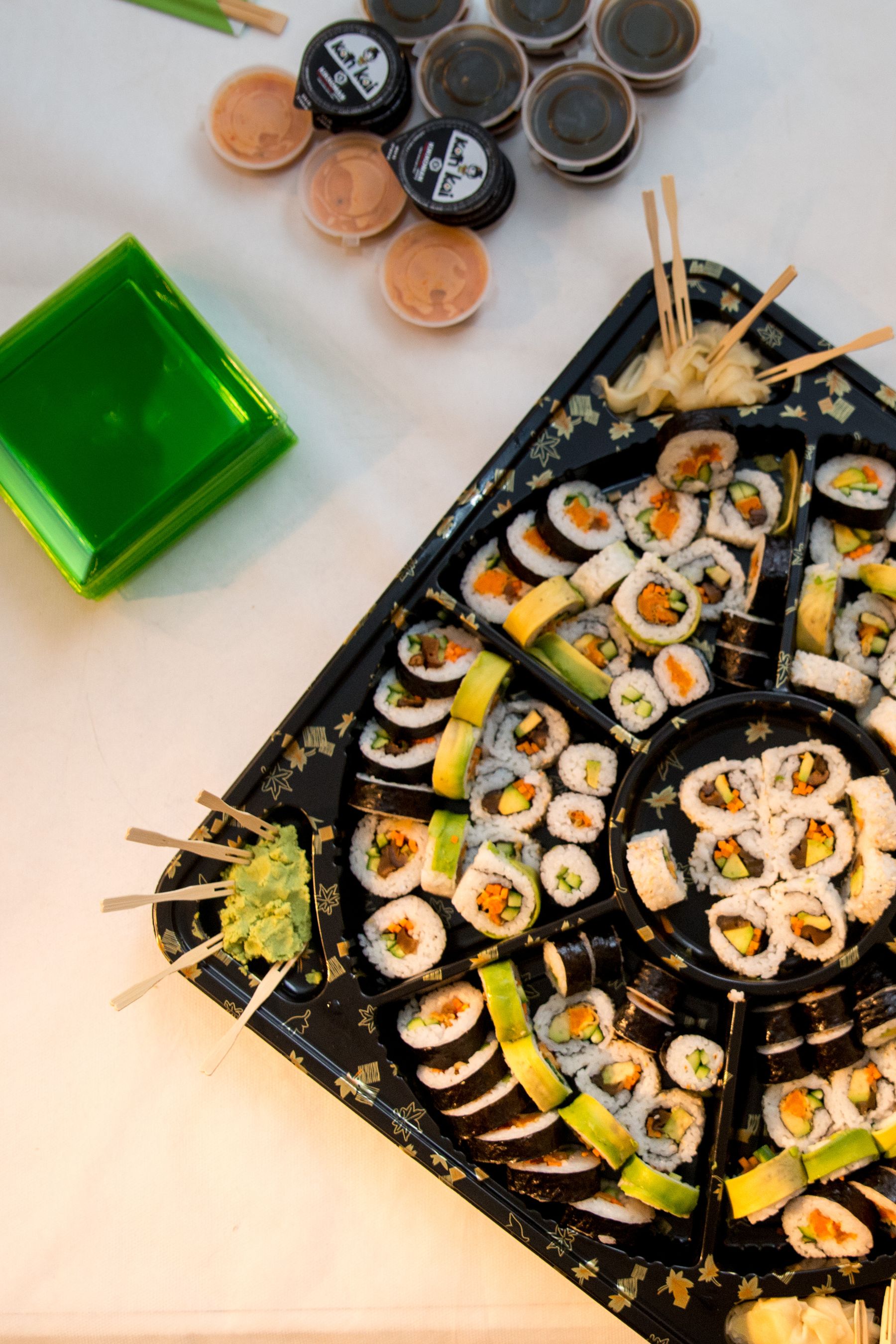 Sushi set arranged on a dark lacquer counter